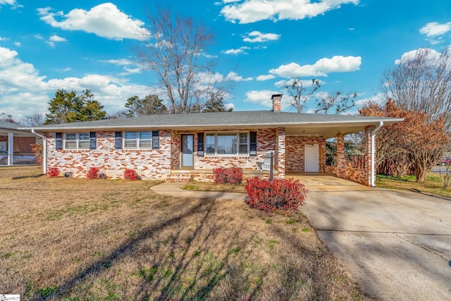 single story home with a front lawn and a carport