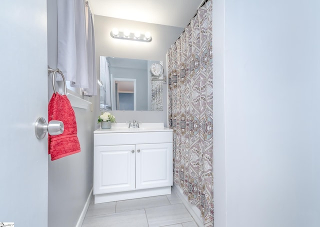 bathroom featuring tile patterned floors and vanity