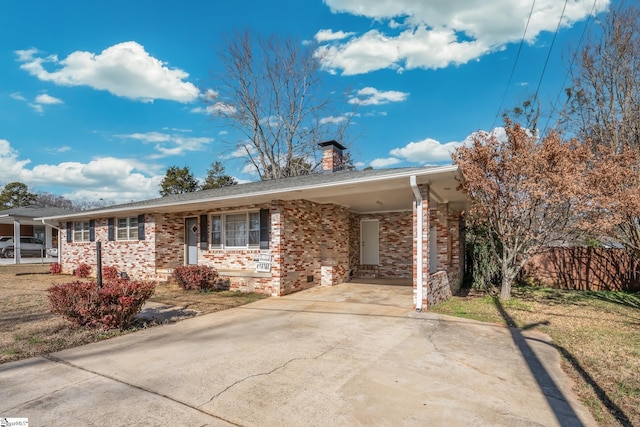 ranch-style home featuring a carport