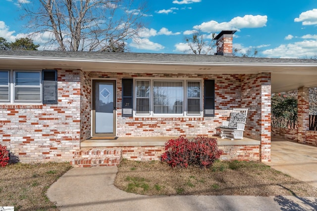 doorway to property featuring covered porch