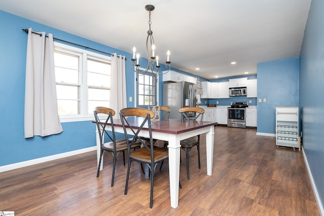 dining space featuring an inviting chandelier and dark wood-type flooring