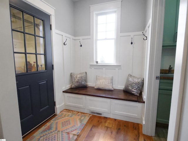 mudroom with hardwood / wood-style flooring and plenty of natural light