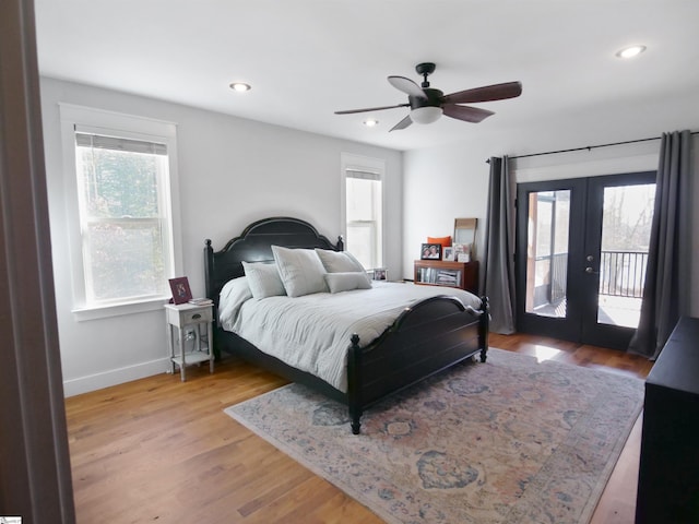 bedroom with french doors, access to outside, light hardwood / wood-style flooring, and ceiling fan