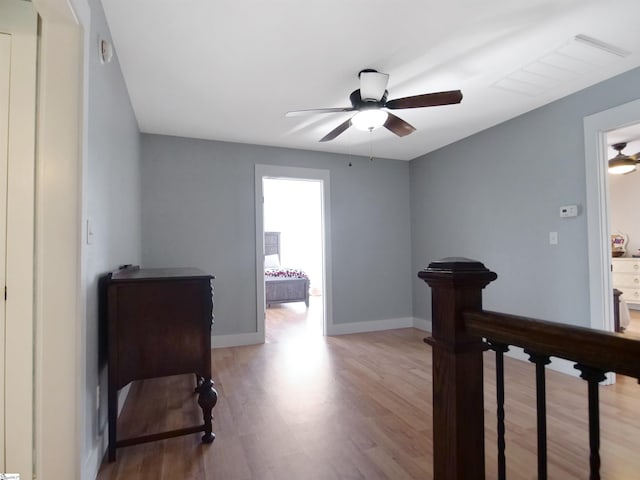 hallway with light hardwood / wood-style flooring