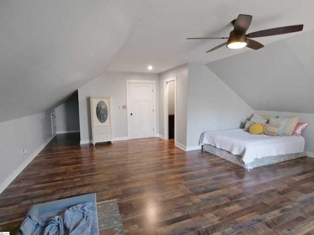 bedroom featuring ceiling fan, lofted ceiling, and dark wood-type flooring