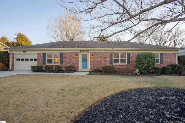 single story home featuring a garage and a front lawn