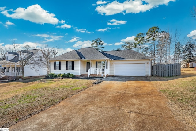 ranch-style house with a porch, a garage, and a front yard