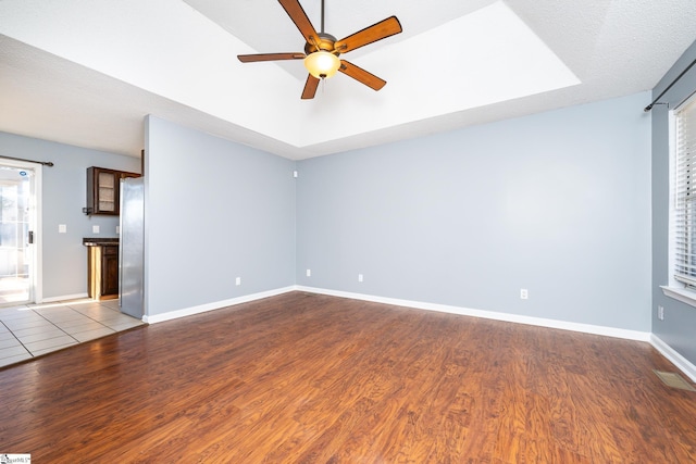 unfurnished living room featuring light hardwood / wood-style floors and ceiling fan