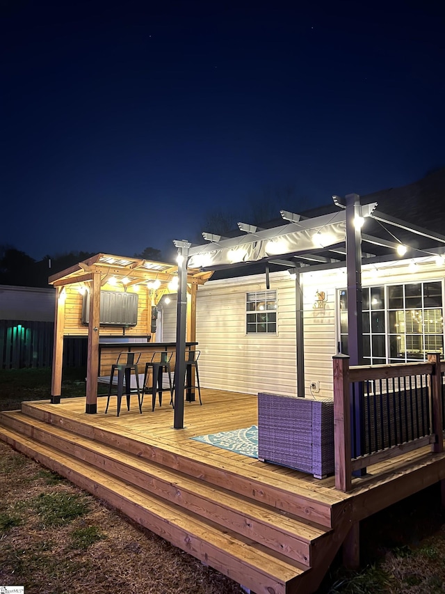 exterior space with a bar, a pergola, and a sunroom