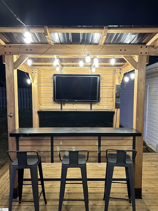 bar featuring wood walls