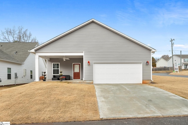 view of front of house with ceiling fan, a front yard, a porch, and a garage