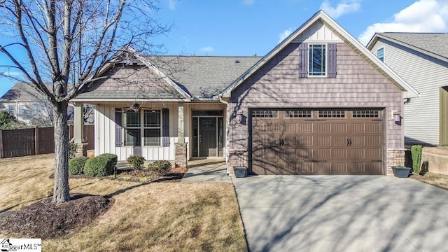 view of front of house featuring a front yard and a garage