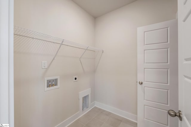 laundry room with washer hookup, light tile patterned floors, and electric dryer hookup