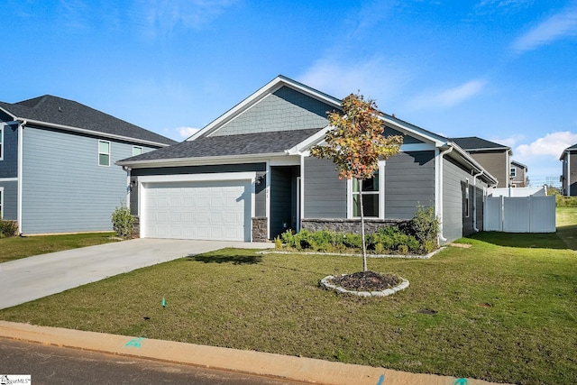 view of front of house with a garage and a front yard