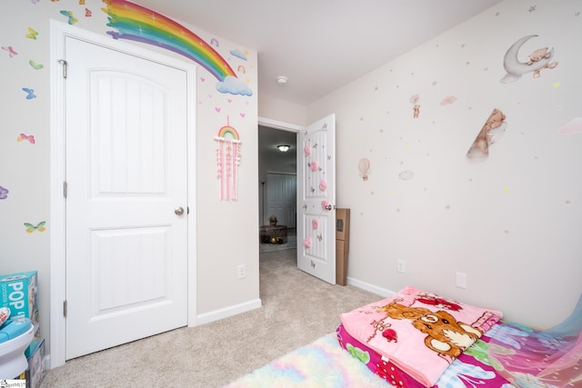 bedroom with light carpet