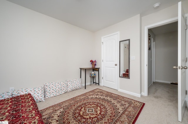 bedroom featuring light colored carpet