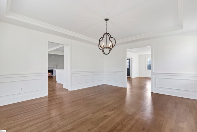 unfurnished dining area featuring dark hardwood / wood-style floors and a notable chandelier