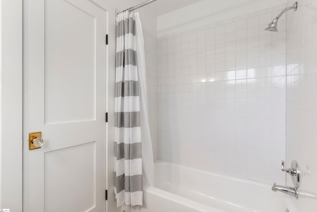 bathroom featuring shower / tub combo with curtain