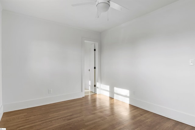 spare room with hardwood / wood-style flooring, ceiling fan, and crown molding