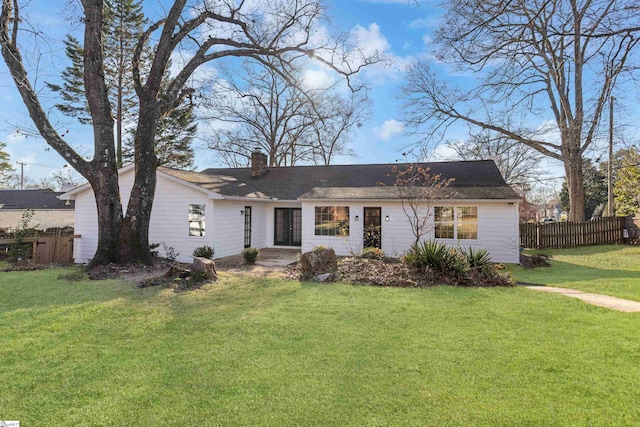 single story home featuring a front lawn