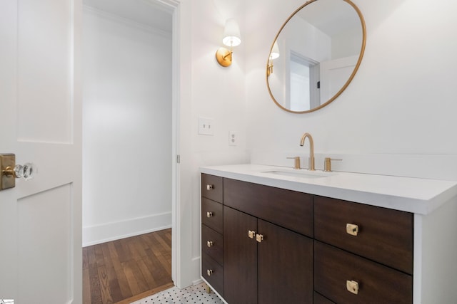 bathroom with vanity and crown molding