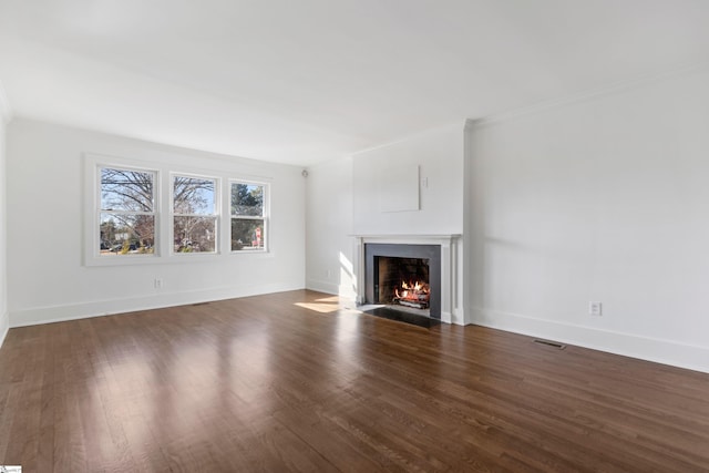 unfurnished living room featuring dark wood-type flooring