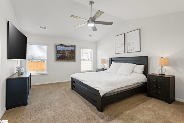 carpeted bedroom with ceiling fan and vaulted ceiling