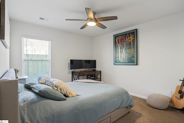 bedroom with ceiling fan and carpet floors