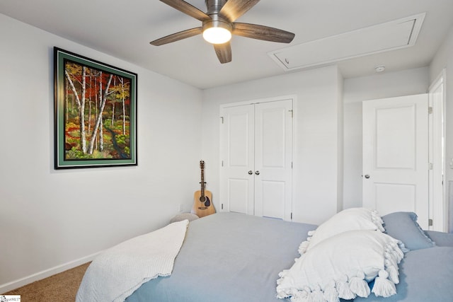 carpeted bedroom with a closet and ceiling fan