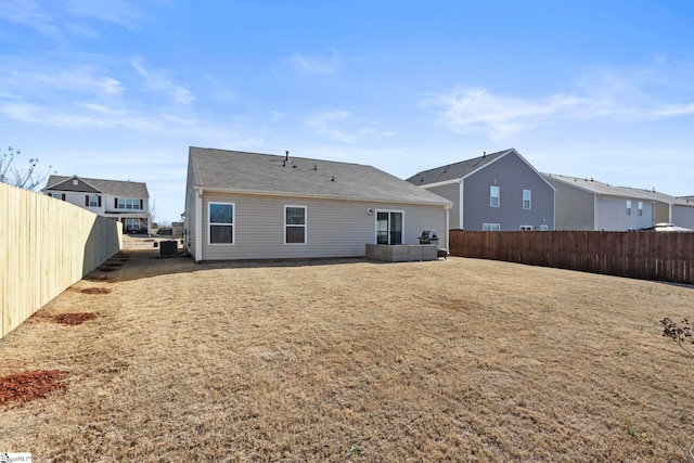 rear view of property featuring central air condition unit