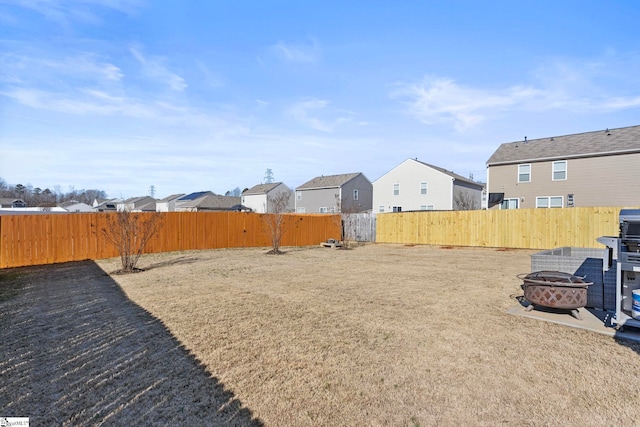 view of yard featuring an outdoor fire pit