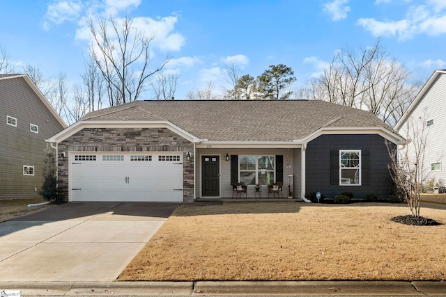 view of front of home featuring a porch and a garage