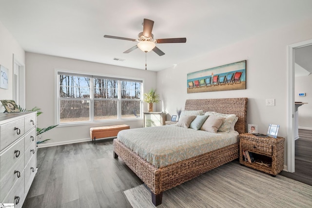 bedroom featuring dark hardwood / wood-style flooring and ceiling fan