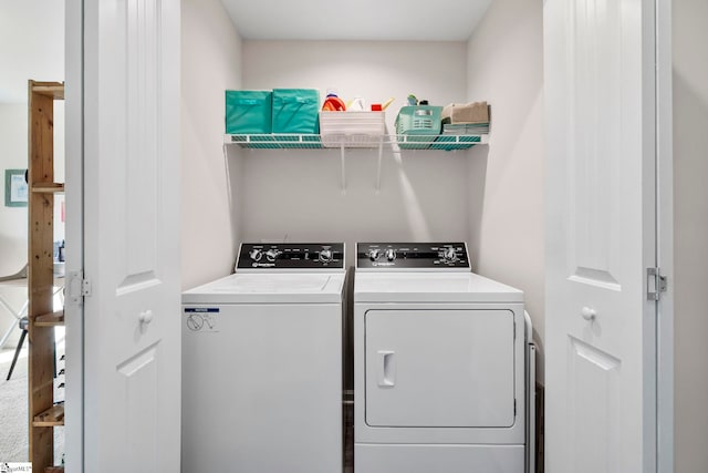 laundry room with washer and clothes dryer