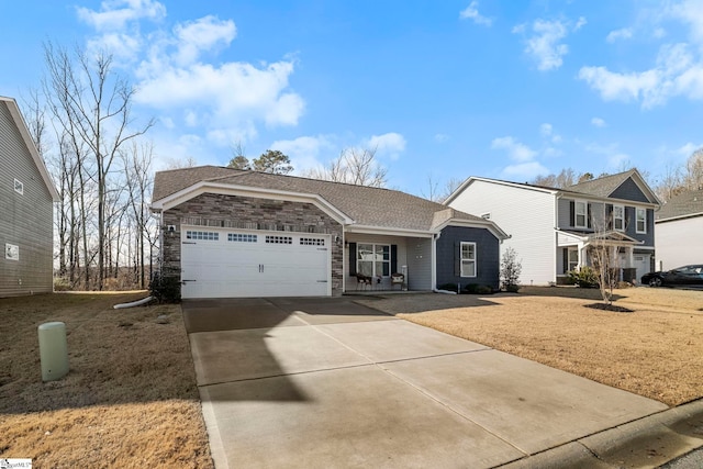 view of front of property featuring a garage and a front yard