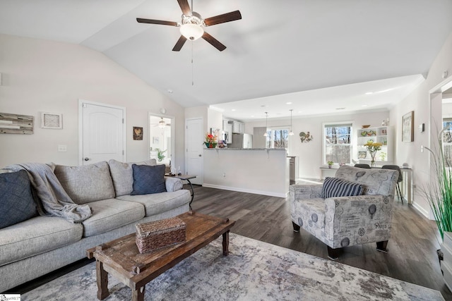 living room with ceiling fan, dark hardwood / wood-style flooring, and lofted ceiling