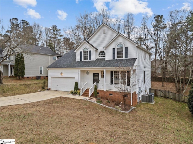 view of property featuring a porch, a garage, central air condition unit, and a front yard