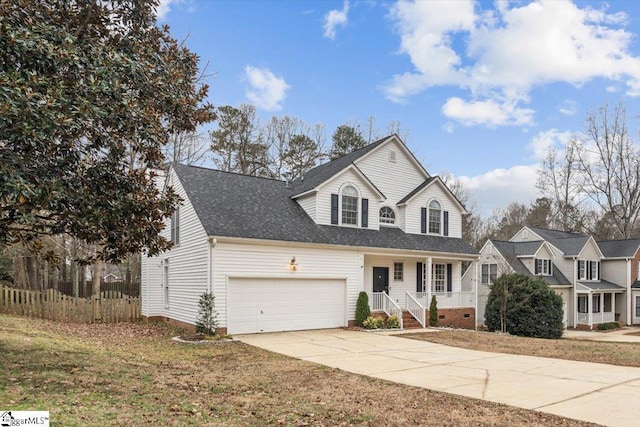 view of front of home with a front yard and a garage