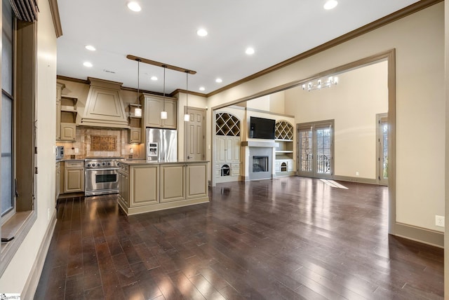 kitchen featuring premium range hood, stainless steel appliances, dark wood-type flooring, a center island, and hanging light fixtures