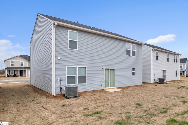 back of house featuring cooling unit