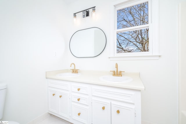 bathroom with vanity and toilet