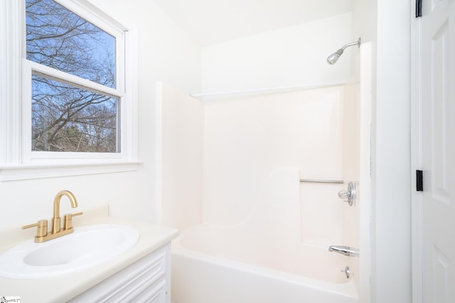 bathroom featuring shower / bathing tub combination and vanity