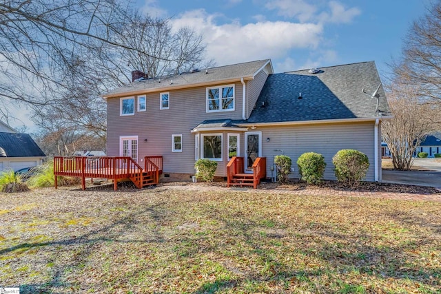 back of house featuring a wooden deck