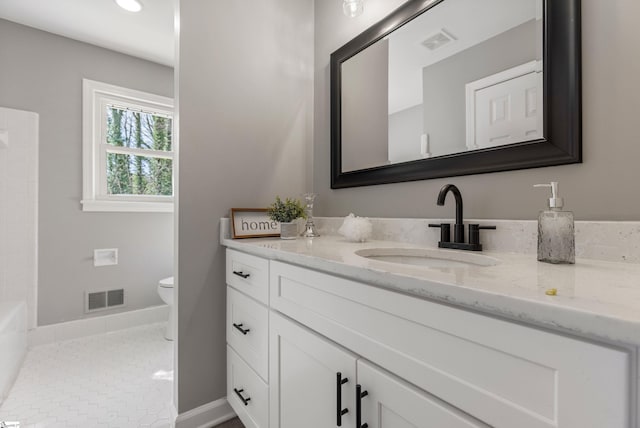 bathroom featuring tile patterned flooring, visible vents, vanity, and toilet