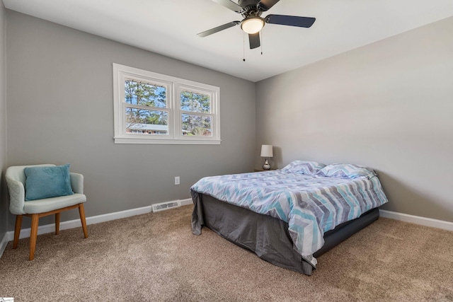 bedroom featuring a ceiling fan, carpet, visible vents, and baseboards