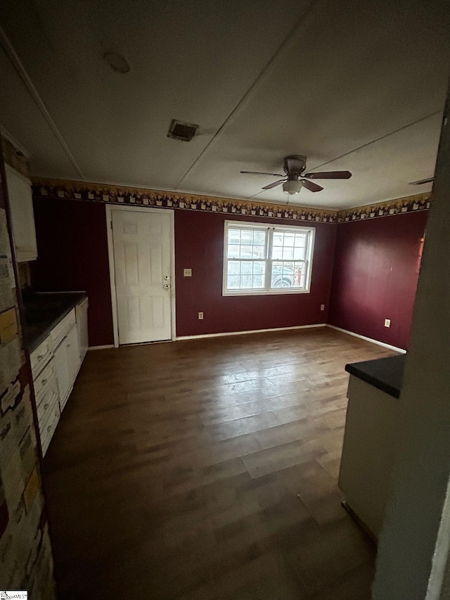 interior space with ceiling fan and hardwood / wood-style floors