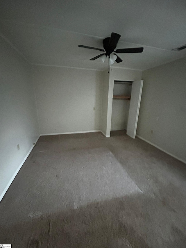 unfurnished bedroom featuring ceiling fan