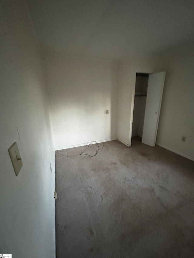 unfurnished bedroom with light carpet