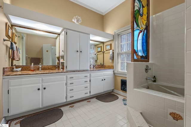 bathroom featuring tile patterned floors, tiled tub, vanity, and ornamental molding