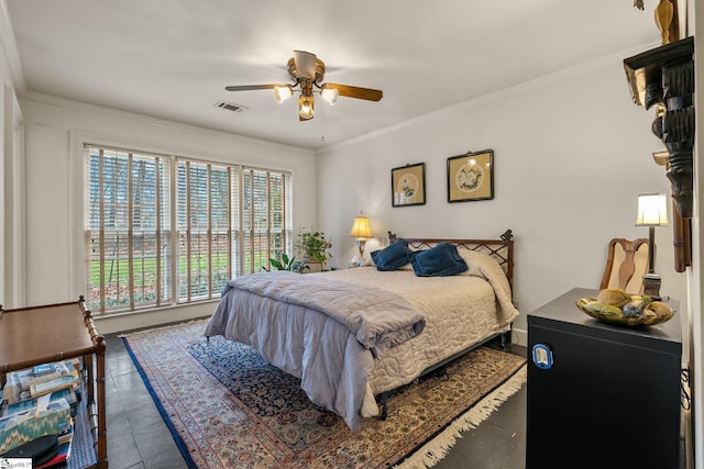 bedroom featuring ceiling fan and crown molding